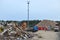 Garbage truck unloads construction waste from container at the landfill. Industrial waste treatment processing plant. Recycling