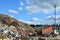 Garbage truck unloads construction waste from container at the landfill. Industrial waste treatment processing plant. Recycling