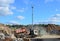 Garbage truck unloads construction waste from container at the landfill. Industrial waste treatment processing plant. Recycling