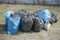 garbage and waste in black and blue bags