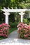 Garden arbor and pink flowers.