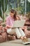 Garden architect working at laptop at yard