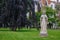 Garden of Begijnhof with ancient Jesus Christ statue. Famous medieval yard with sculpture of Jesus Christ in Amsterdam.