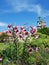 Garden in the castle of Wawel. Towers of the cathedral. Flower beds. Lilies and trees