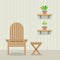 Garden Chair And Table With Pot Plants On Wooden Wall