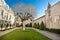 Garden of Chateau Haut Brion, Bordeaux France. Beautiful formal garden, courtyard with statue  on lawn 