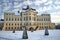 garden and classicist facade of the palace in the village of Rogalin during winter