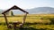 Garden Decor with Wooden Pergola and Green Meadow View. Serene Nature Scene. Horizontal sharing