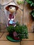 Garden decoration of a funny statue watering the plants