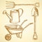 Garden fork, barrow, watering can and shovel, background