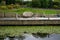 Garden furniture on a jetty overlooking a river