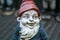 Garden gnome with blue shirt and red cap