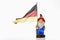 Garden gnome and german flag on white background