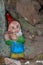 Garden gnome in a tree cave