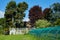 Garden, greenhouse and villa in a sunny day, Italy