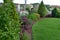 Garden with group of ornamental colourfull shrubs perennials and conifers