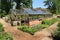 Garden with hothouses in Great Dixter House & Gardens in the summer.