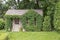 Garden house covered with vines