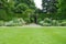 Garden Lawn, Stone Path, Flower Bed and Leafy Trees