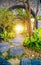 Garden with natural arch entrance and sun rays, magical door gates in fabulous green forest