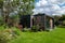 Garden office room for home working, with living ecofriendly sedum roof and black and cedar cladding