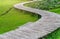 Garden path way which made of bamboo tree. Curve of walkway in garden, perspective view, day light image