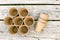 Garden peat cups for seedlings on a wooden background. A conceptual image of garden equipment with a copy space