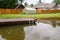 Garden pond with floating footbridge