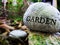 Garden Rock Stone with blurred background Foiliage