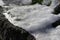 Garden rocks covered with slushy snow