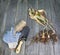 Garden shovel, gloves and dug dry tulips on the old wooden table