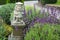 Garden stone sculpture of merchant. New Zealand, South Island, Dunedin, Otago Peninsula. Larnach Castle