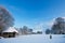 Garden with summerhouse covered in fresh snow