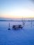 Garden table in snowy sunset in Sweden