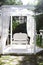 In the garden there is terrace on which a white sofa in style of Provence or rustic. Beautiful sofa is on podium Outdoor. Summer g