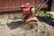 Garden tiller turning over dirt