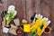 Garden tools, hyacinth flowers and plants on a rustic wooden background, frame. Gardening concept. Top view