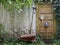 Garden tools leaning against wall of house