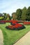 Garden with topiary trees, flower beds, and statues