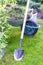 Garden wheelbarrow with earth, grass