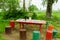 Garden wooden table bunch flowers colorful stumps