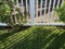 garden wooden white wood picket fence grass yard sunlight shadow backyard