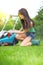 Garden work, woman mowing grass with lawnmower