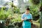 Gardener or botanic worker checking some plants