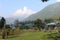 A gardener cutting grass in a beautiful park in Pahalgam