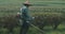 Gardener cutting grass in park