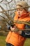 Gardener cutting tree