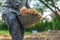 Gardener digs the soil with his equipment for gardening and prepare land for plantation