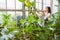 Gardener or florist in the greenhouse