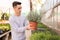 Gardener growing potted lavender